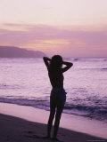 Woman Standing on Beach in Silhouette Photographie par Bill Romerhaus
