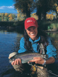 Woman Fly Fishing in Co, Holding Fish Photographic Print by Paul Gallaher