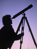 Silhouette of Woman Looking Through Telescope Photographic Print by Ken Wardius