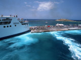 Ferry Docking, Los Island, Greece Photographic Print by Walter Bibikow