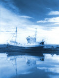 A Fishing Boat Ran Aground on a Lagoon, Iceland Photographic Print by John Coletti