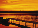 Sunrise on Pier and Boat Photographic Print by Ken Wardius
