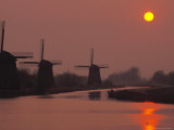 Windmills Along Rural River Photographic Print