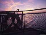 Boat on the Ocean at Sunset Photographic Print