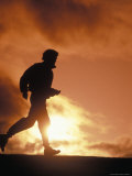 Man Jogging At Sunset Lámina fotográfica