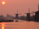 Sun Setting Over Windmills Photographic Print