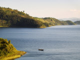 Passenger Boat on Lake Burera Near Ruhengeri at the Virunga Mountains, Rwanda Photographie par Ariadne Van Zandbergen
