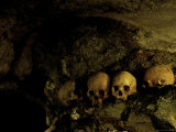 Skulls in Caves, Indonesia Print by Michael Brown