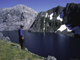 A Climber Enjoying the View Over a Mountain Lake, Chile Posters by Pablo Sandor