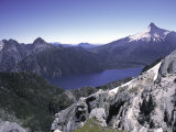 Blue Lake Surrounded by Mountains, Chile Print by Pablo Sandor