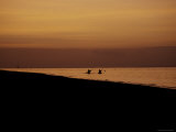 Kayakers at Sunset, Indonesia Prints by Michael Brown