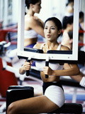 Young Woman Exercising in a Gym Photographic Print