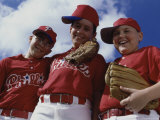 Low Angle View of Three Boys on a Baseball Team Photographic Print