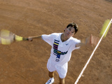 High Angle View of a Young Man Playing Tennis Photographic Print
