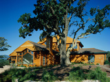 Panoramic View of a Log Cabin on a Hill Photographic Print