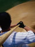 High Angle View of a Baseball Player Swinging a Baseball Bat Photographic Print
