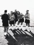 Female Soccer Team Standing in Front of Their Couch Photographic Print