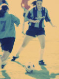 Teenage Girls Playing Soccer Photographic Print