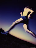 Low Angle View of a Young Woman Running Lámina fotográfica