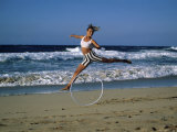 Woman with Hula Hoop on the Beach Photographic Print