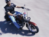 High Angle View of a Young Man Riding a Motorcycle Lámina fotográfica High Angle View of a Young Man Riding a Motorcycle Lámina fotográfica