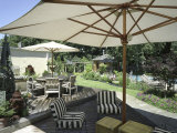 Deck Chairs in the Shade of an Umbrella Photographic Print