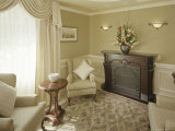 Living Room with Flower Arrangment on Mantel Photographic Print