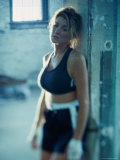 Young Woman Resting Against a Wall Photographic Print