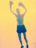 Female Boxer Raising Her Arms Photographic Print