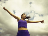 Low Angle View of a Young Woman Exercising Photographic Print