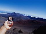 Person Holding Out a Compass Photographic Print