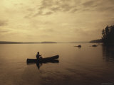 Silhouette of a Canoe in the Water Photographic Print