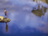 Boy Fishing from a Rock on a Pond Photographic Print