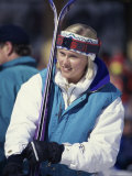 Young Woman Holding Skis Photographic Print