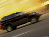 Side View of a Speeding Car Photographic Print