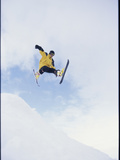 Young Man in Mid Air Wearing Skis Photographic Print