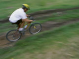 Motion Blurred Image of a Cyclist on a Path Photographic Print