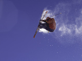 Low Angle View of a Skier in Mid Air Photographic Print