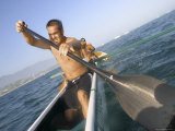 Men Paddling a Canoe Photographic Print