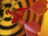 Close-up of Three Darts in the Bull's-Eye of a Dartboard Photographic Print
