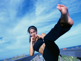Young Woman Kickboxing Photographic Print