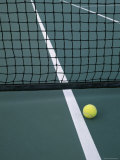 Tennis Ball Resting Near Net Photographic Print