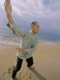 Senior Man Practicing Tai Chi on the Beach Photographic Print