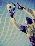 Low Angle View of a Goalie Catching a Ball Photographie