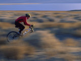 Blurred Landscape with Bicyclist Photographic Print