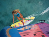 High Angle View of a Young Woman Windsurfing Photographic Print