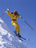 Skier in Yellow Against a Blue Sky Photographic Print