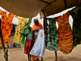 A Sudanese Woman Buys a Dress for Her Daughter at the Zamzam Refugee Camp Photographic Print by Nasser Nasser