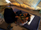 An Iraqi Mother Fans Her Children Photographic Print