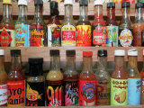 These are Sample Bottles of Hot Sauce Sold by Kaufman's Fancy Fruit and Vegetables Lámina fotográfica por John Gillis